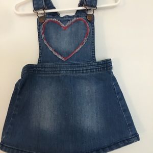 Blue overall with red heart in the middle